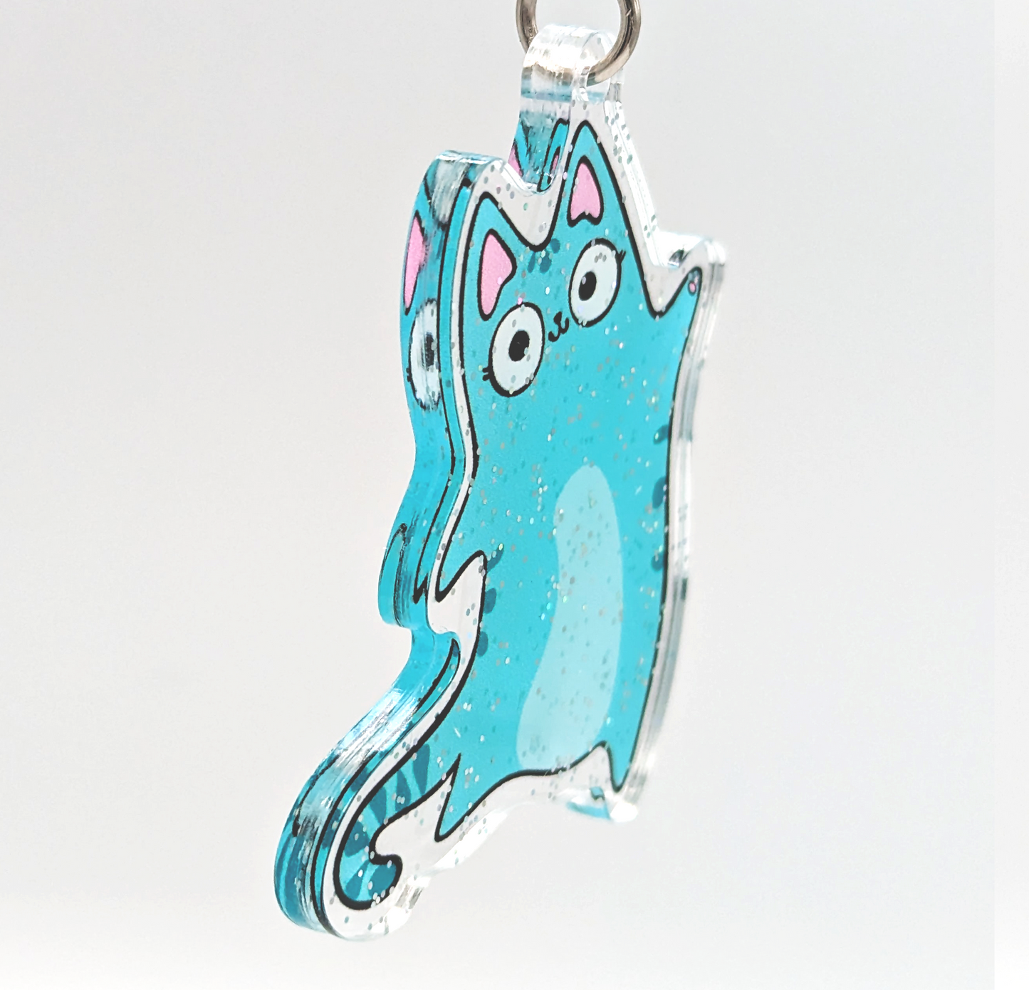 Sideview of blue tabby cat glitter keychain