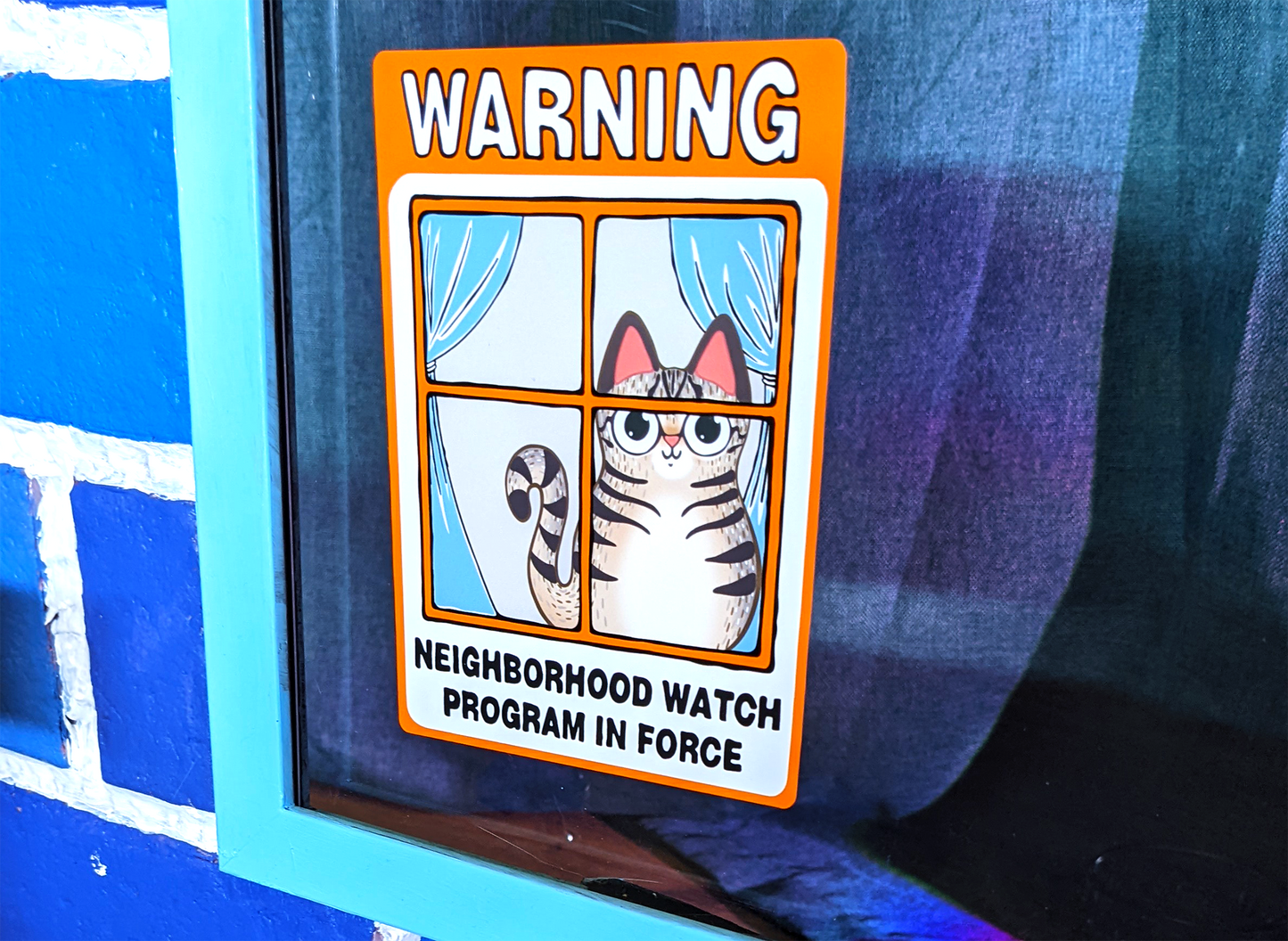 Neighborhood Watch Cat Window Cling of happy indoor tabby cat looking out window