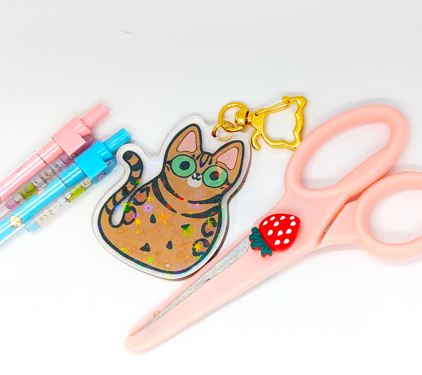 Cute Bengal Cat acrylic keychain with holographic stars.