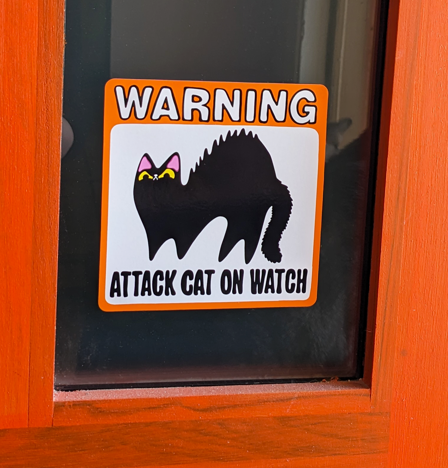 Attack Cat on Watch art on window cling stuck to glass on door. A gift for cat lovers