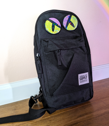 A small backpack is turned into a monster with monster eyes pin, a great gift for halloween decoration