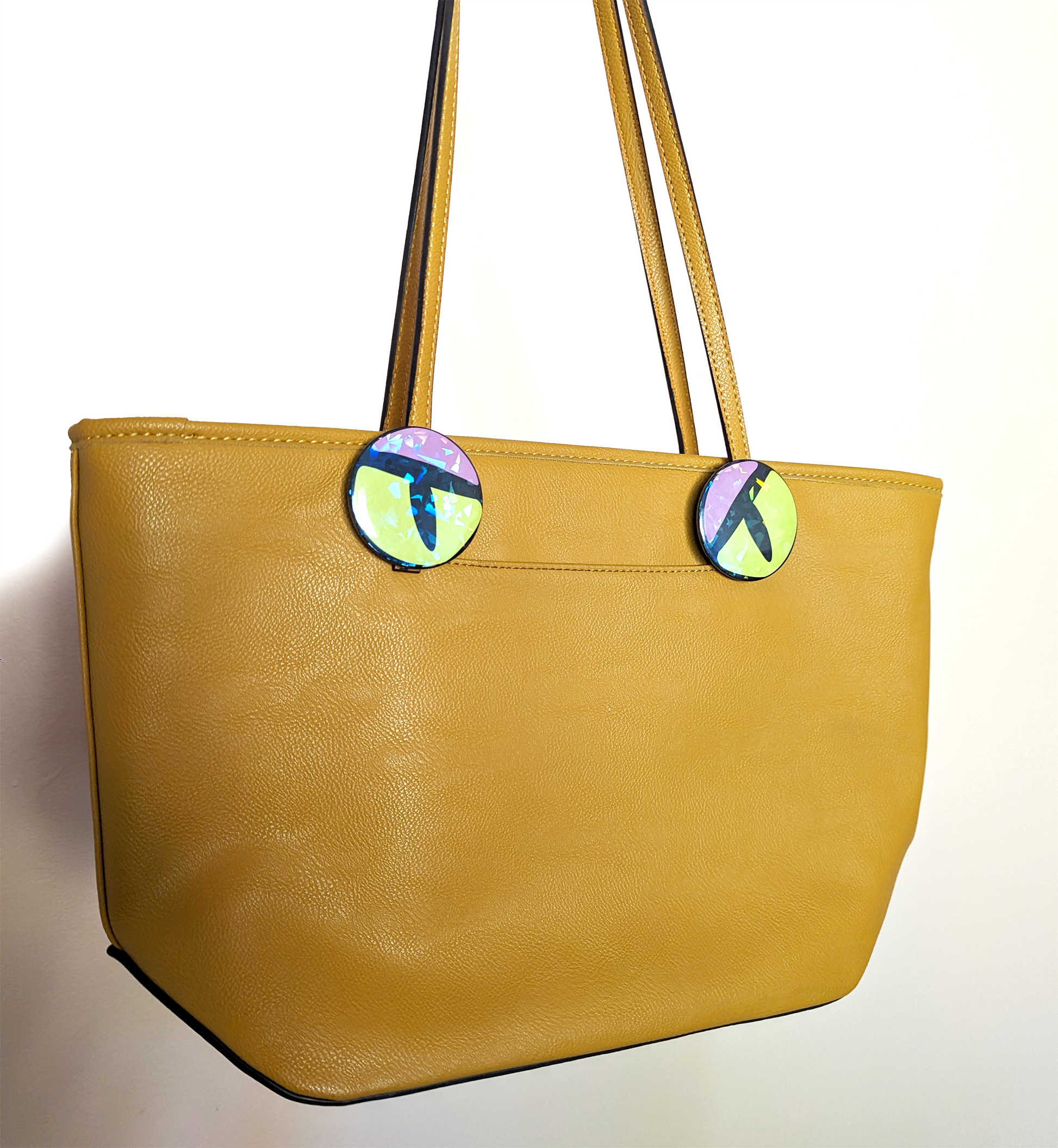 Monster purse with angry eyes. Two monster eye buttons turn a shoulder bag into an evil mosnter