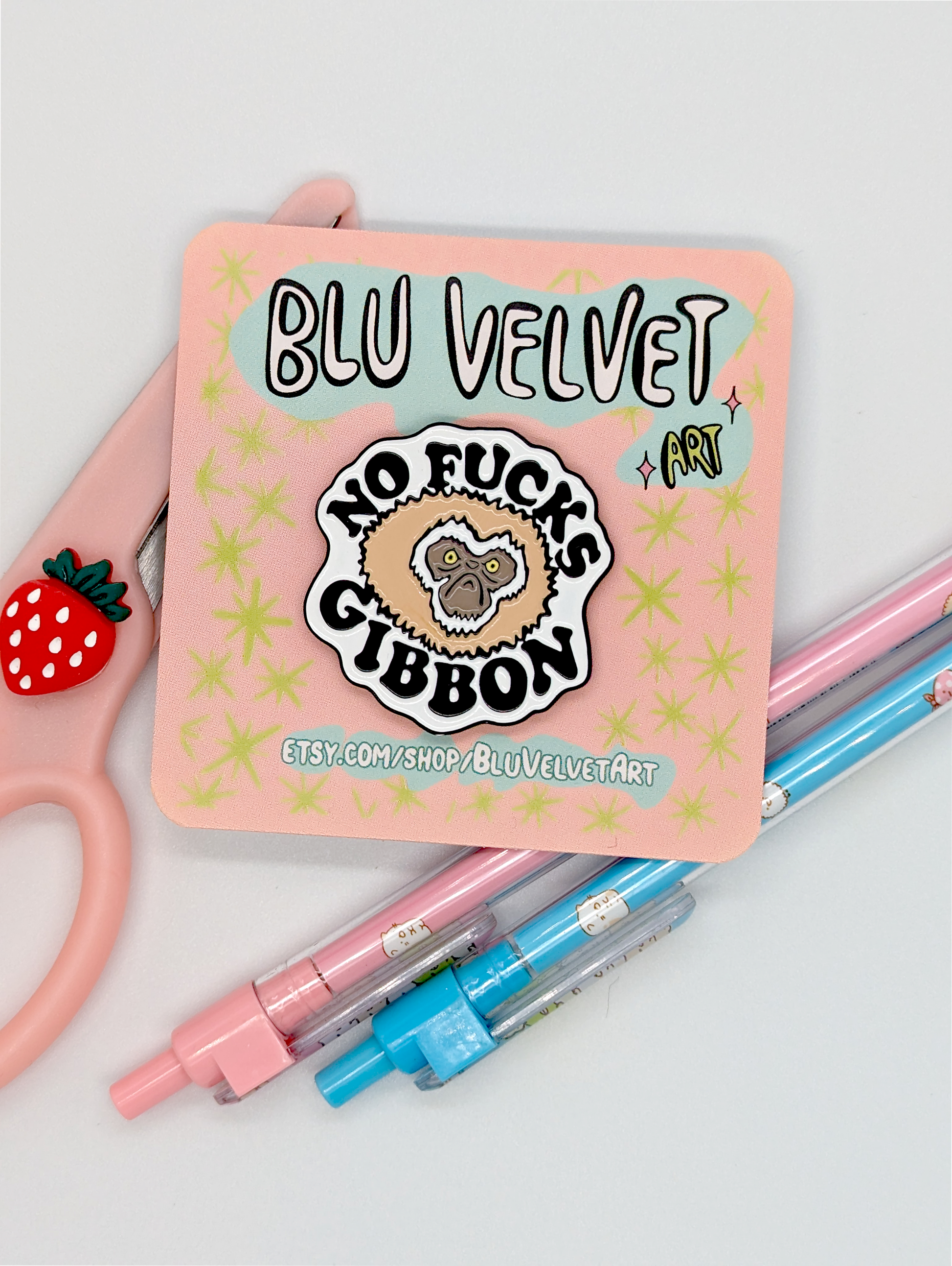 funny animal pun pin that reads "no fucks gibbon" and has a cartoon gibbon