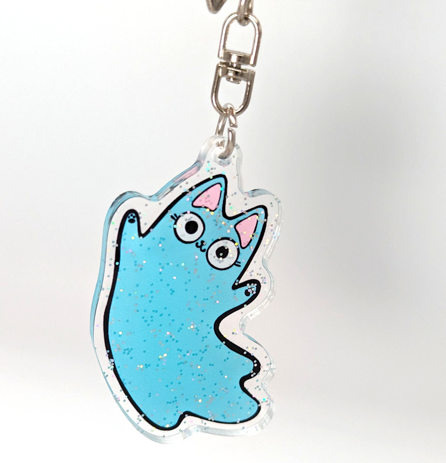 close up of Ghost Cat keychain. A cheap cat gift for cat lovers!