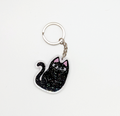 Full view of black cat glitter keychain. A sparkly gift for those who love black cats!