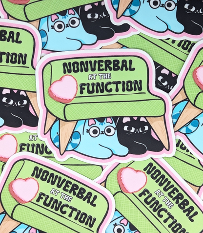 Nonverbal at the Function Cat Sticker Heavy Duty Vinyl 3" for antisocial people and austism awareness. Sticker features two cats hiding under a couch. Picture showcases many stickers