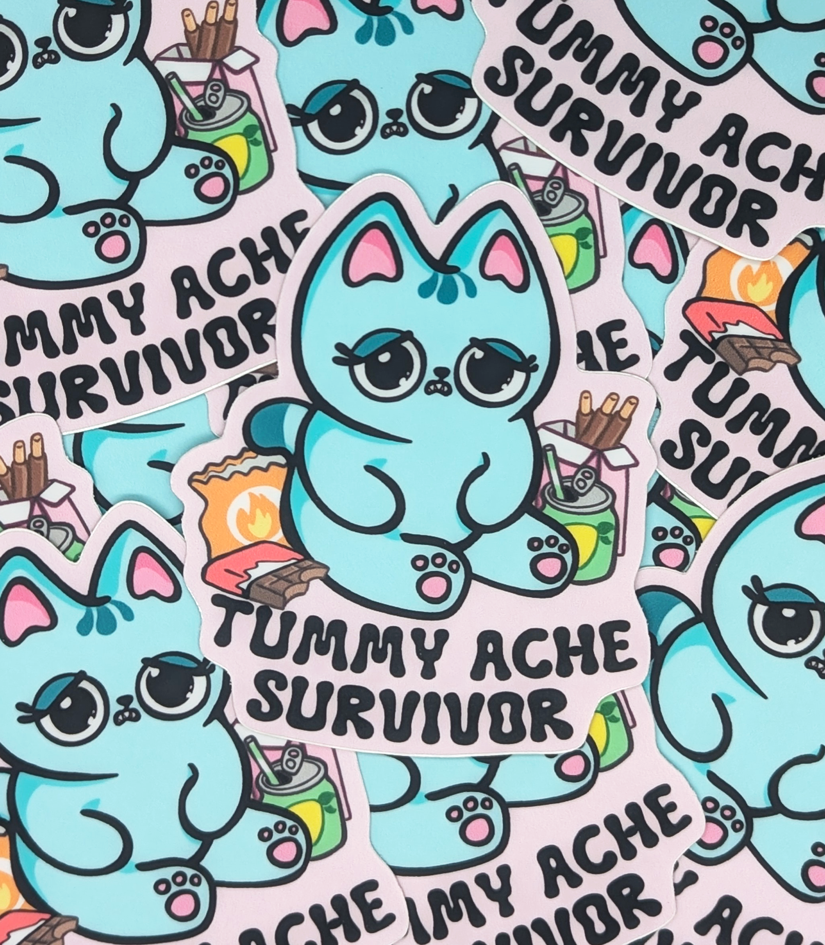 Kawaii Blue Cat is surround by snacks such as chocolate bar, lemon soda, pocky and spicy chips.Cute little cat has a stomach ache after eating yummy snacks! Tummy Ache Survivor Cat Sticker Heavy Duty Vinyl 3" 