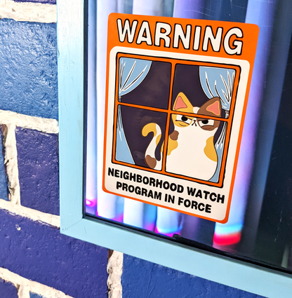 Neighborhood Watch Cat window cling that has judgy calico cat