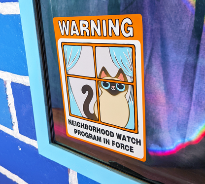 Neighborhood Watch Cat Window Cling displayed on a home window