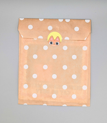 Orange Tabby Cat Curious in eco-friendly paper packaging