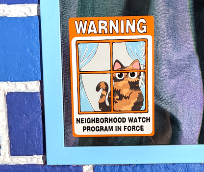 close up of derpy tortie cat on a Neighborhood Watch Cat Window Cling