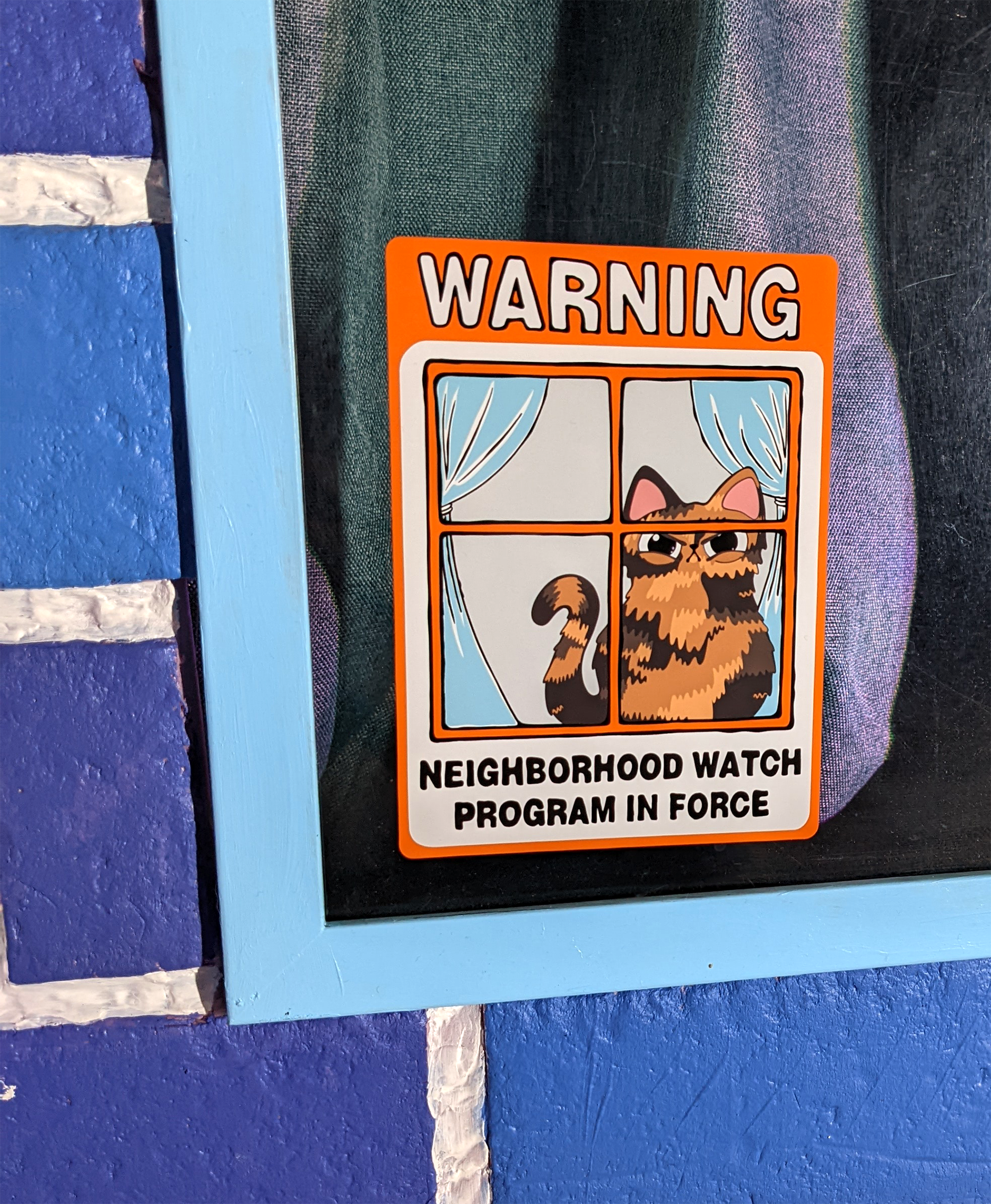 close up of Neighborhood Watch Cat Window Cling of judgmental Tortie Tortoiseshell Cat 