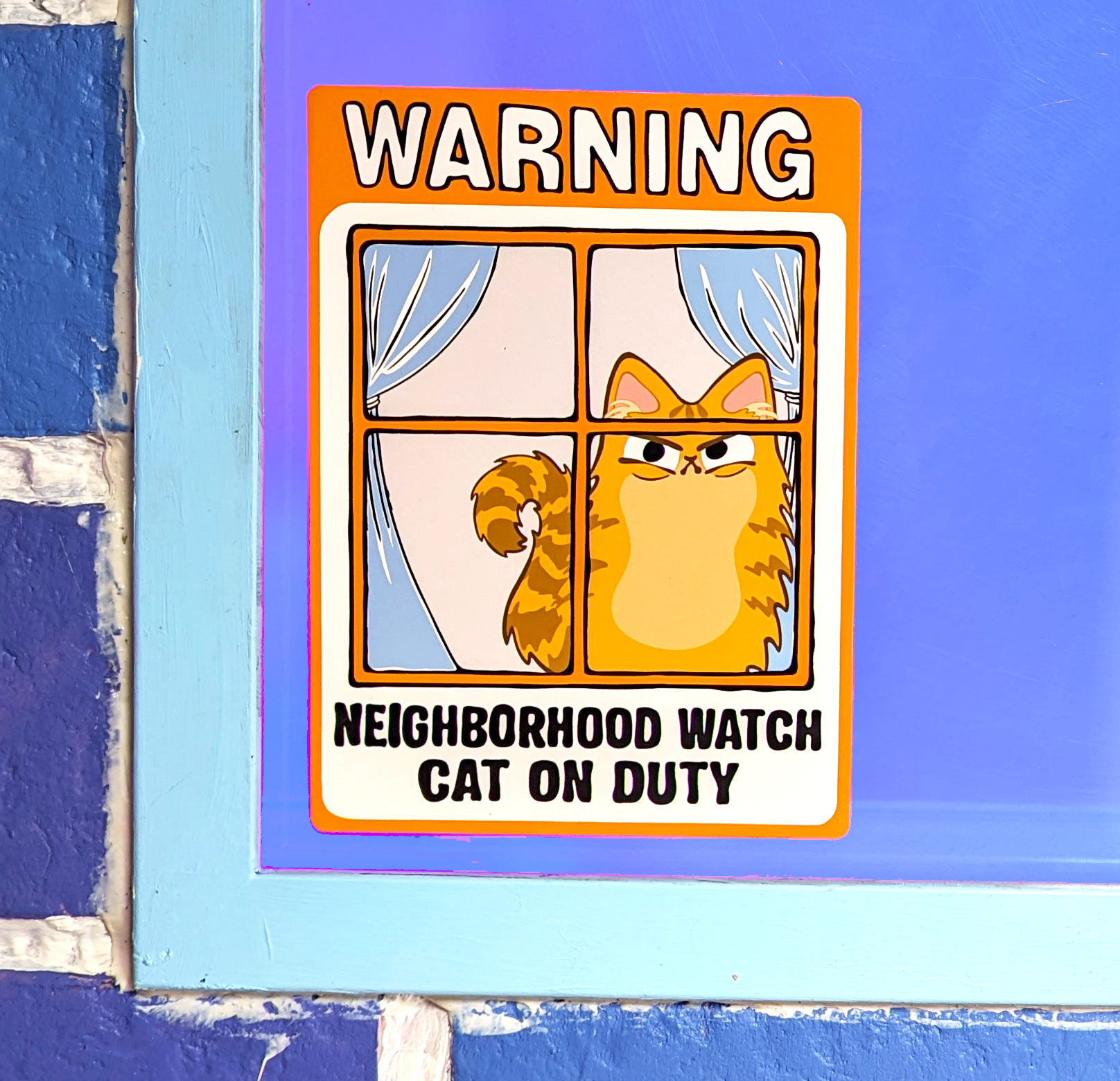 close up of Neighborhood Watch Cat Window Cling  of Orange Tabby cat that's Fluffy and Judgy