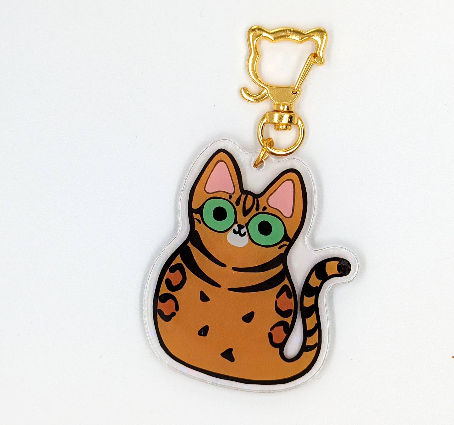 Cute Bengal Cat acrylic keychain with holographic stars and cat shaped attachment